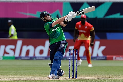 Mark Adair plays a shot against Canada